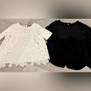 Size medium women’s shirts with lace/cut out detail, white and black